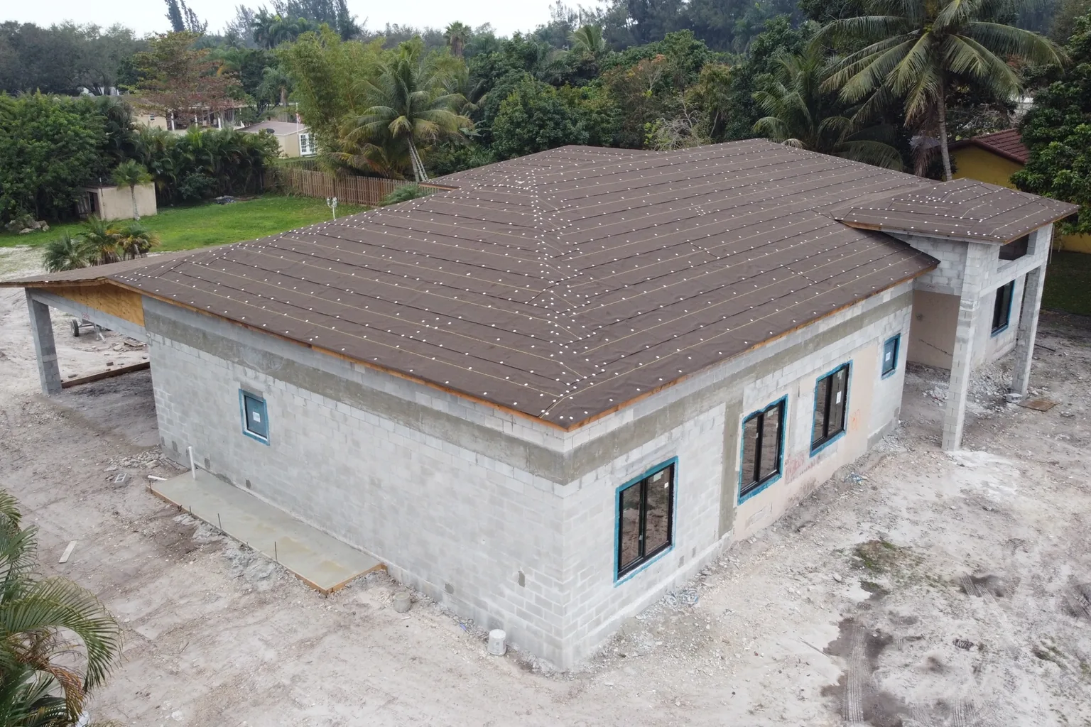 Aerial view of completed block walls with the roof deck on, ready for dry-in