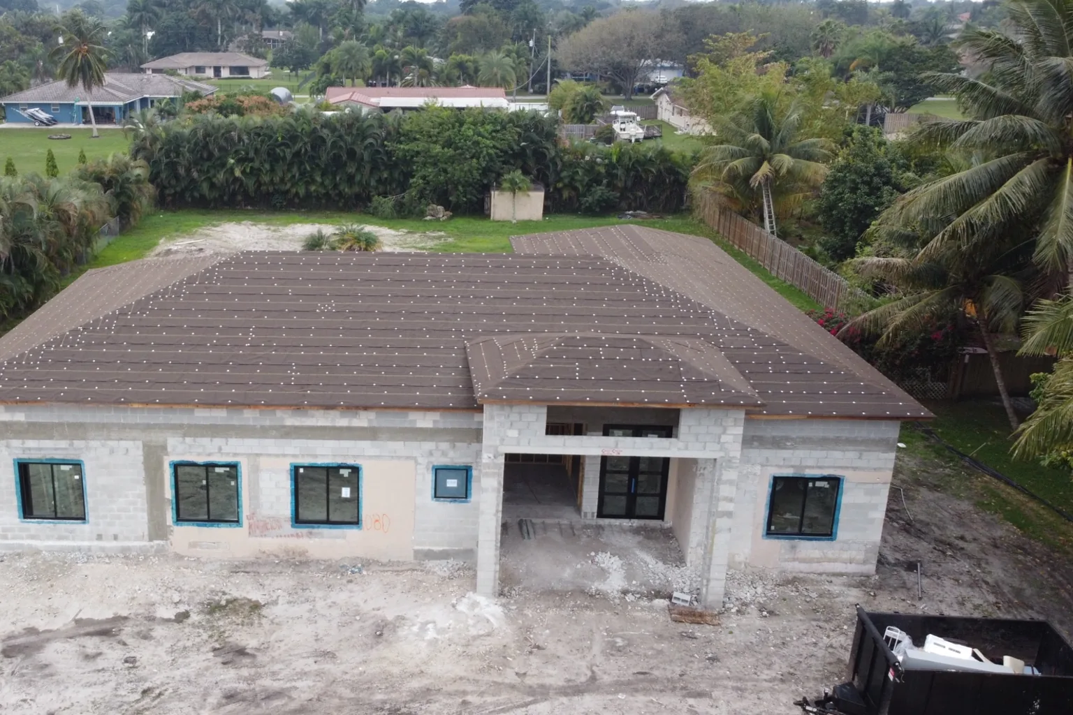 Side and rear of completed block walls with roof deck on